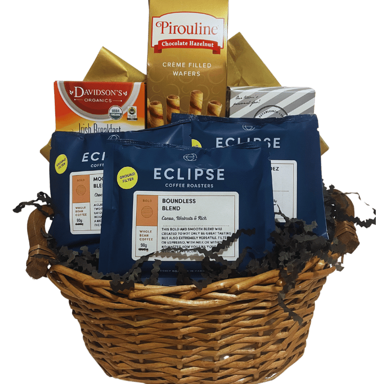 Neutral-themed gift basket with ‘Eclipse Coffee Roasters’ coffee varieties, ‘Davidson’s Organics’ black tea, ‘Pirouline’ chocolate hazelnut wafers, and ‘Cookie It Up’ shortbread cookies.