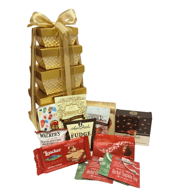 Elegant tower of golden gift boxes wrapped with shiny gold ribbons and bows, filled with gourmet treats including cookies, chocolate truffles, hot chocolate, and more, perfect for corporate gifting.